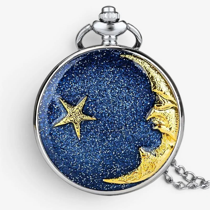A silver-toned moon star pocket watch with a glittering blue face featuring a golden crescent moon and star design
