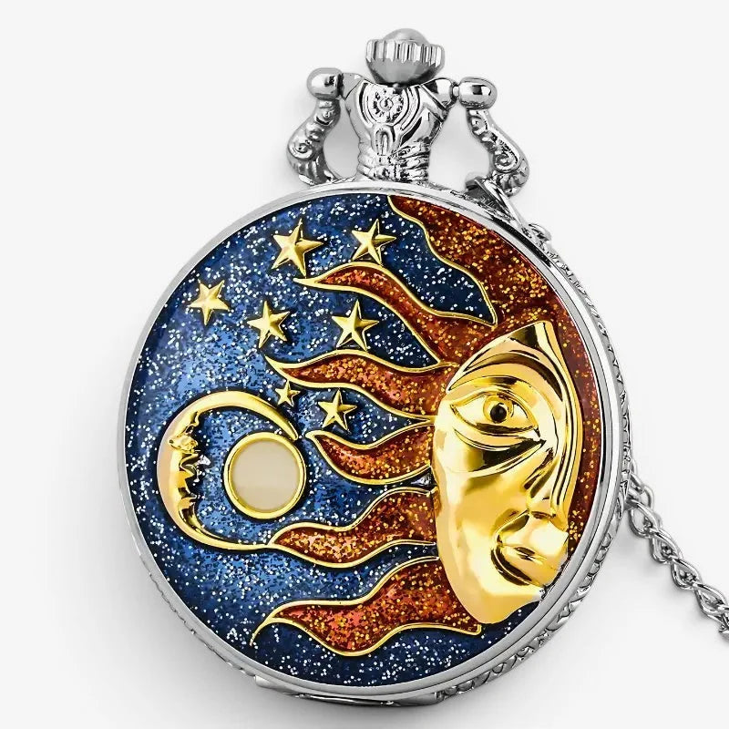 A silver-toned moon star pocket watch with a celestial gold sun and moon design on a blue and orange background