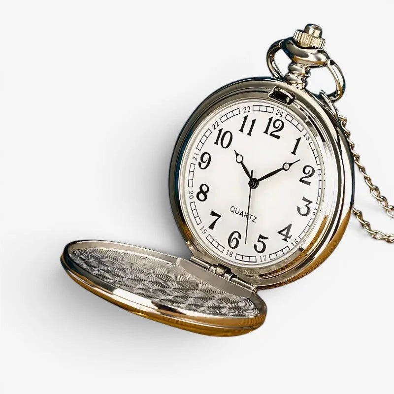 Moon star pocket watch silver-toned with white face black arabic numerals and ornate engraved inner lid