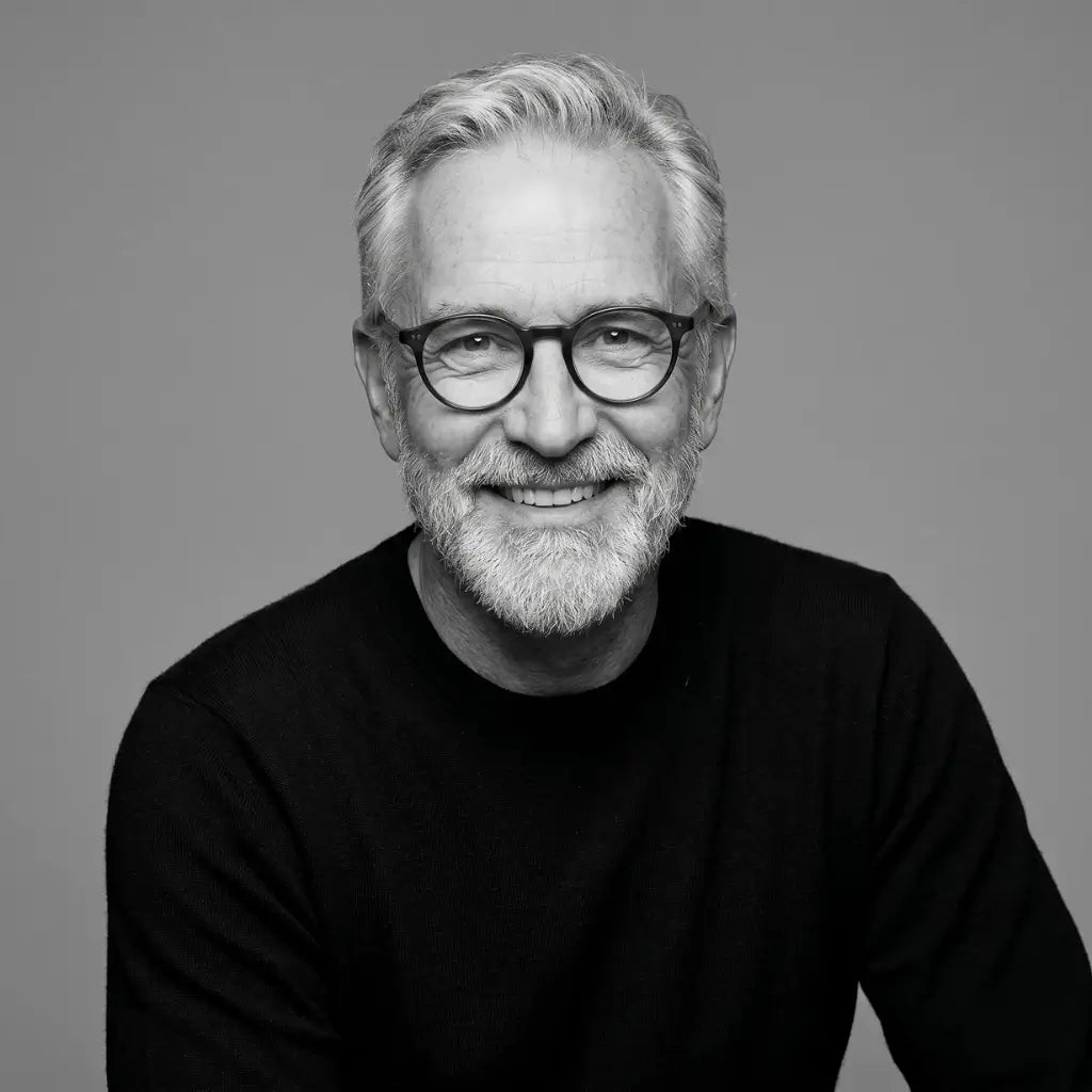 Black and white portrait of a man with glasses and a beard on a gray background pocket watch