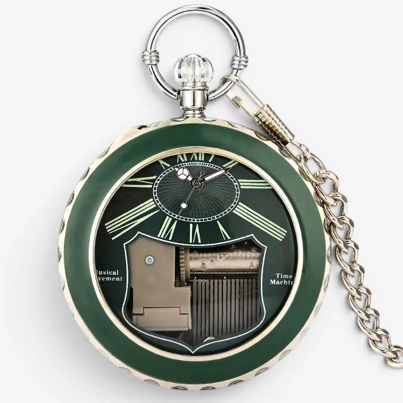 Musical pocket watch featuring green enamel face, silver-toned metal casing, roman numerals, and visible mechanical movement