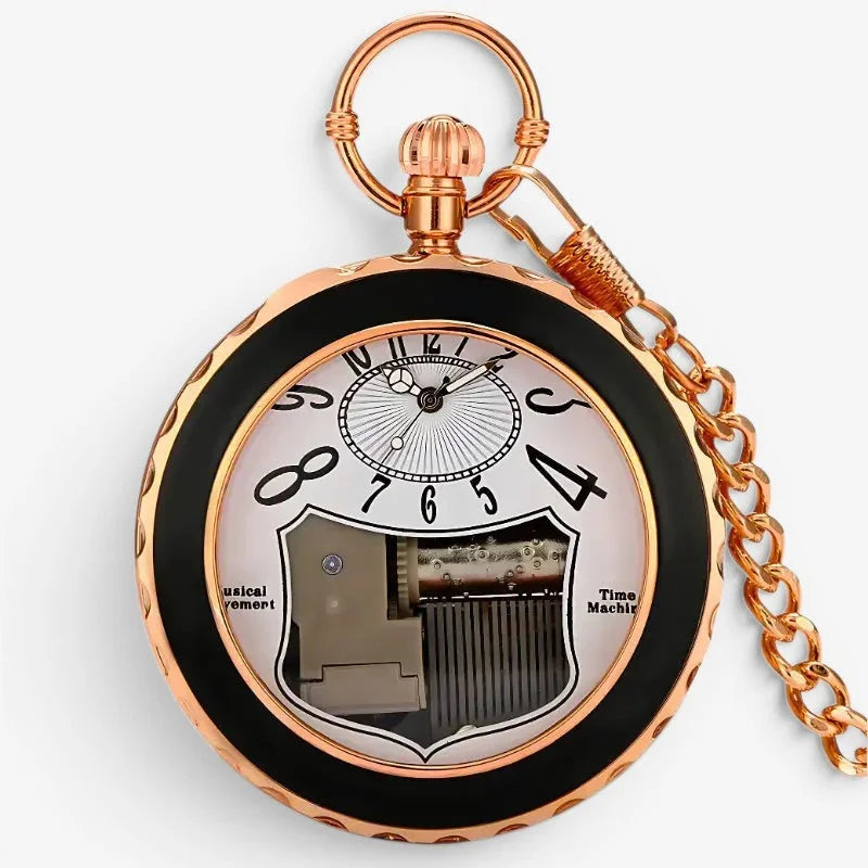 Rose gold musical pocket watch with black bezel and visible mechanical movement featuring ornate design