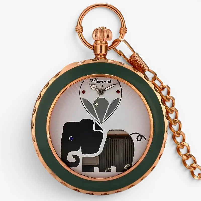 Rose gold musical pocket watch with a green enamel bezel and a whimsical black elephant design on the dial