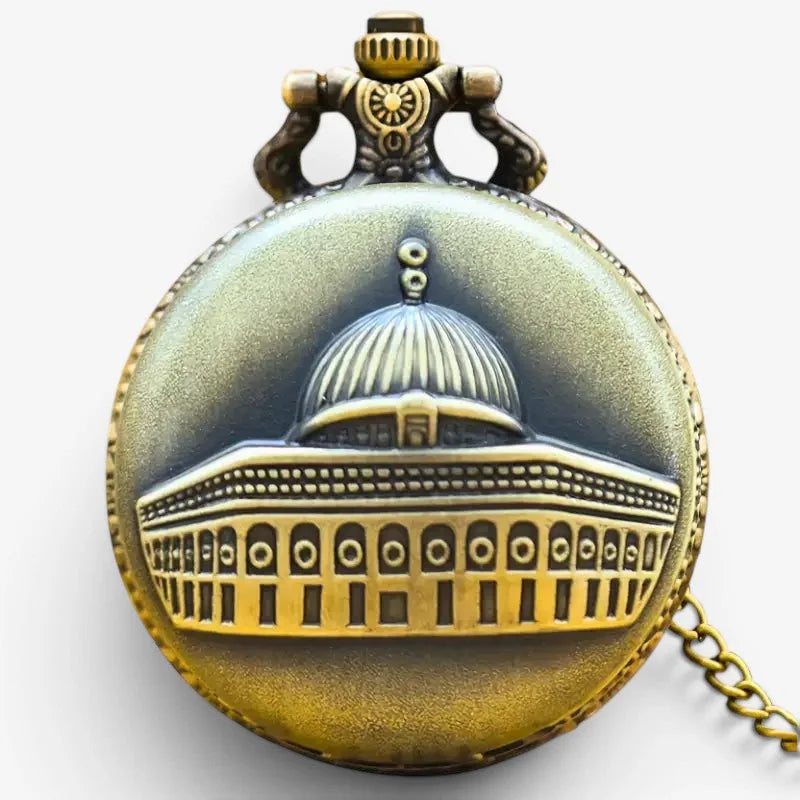 Antique brass-colored Muslim pocket watch with detailed dome of the rock relief, ornate hinges, and attached chain