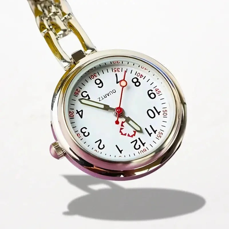 Silver-toned nurse clip watch with white dial black arabic numerals and red second hand and hour markers