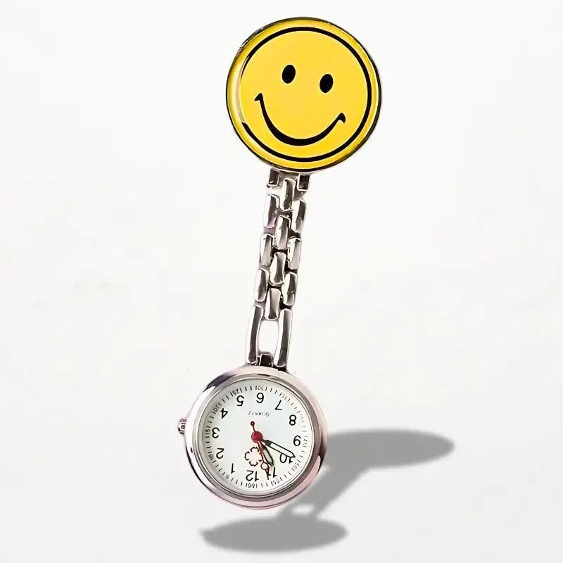 Yellow smiley face pin attached to a silver chain nurse clip watch with white dial for healthcare professionals