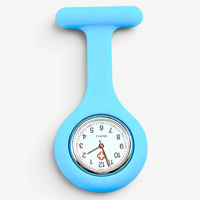 Light blue silicone nurse fob watch with a round analog clock face and red medical cross emblem