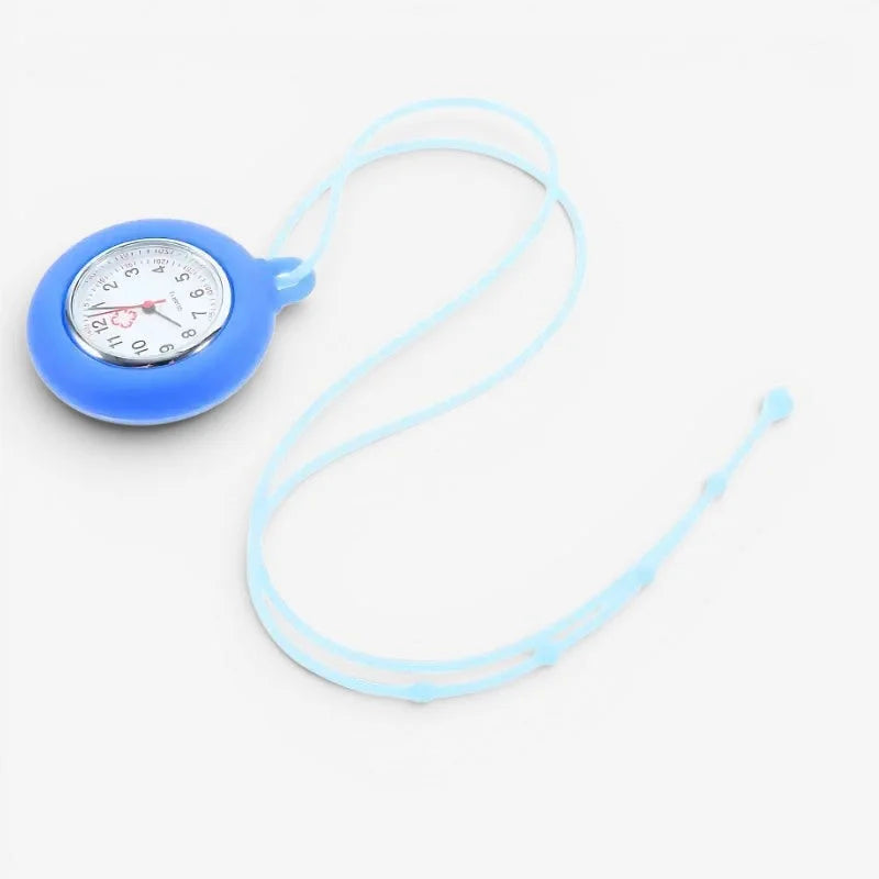 Blue silicone nurse pendant watch with white face pink heart detail attached to light blue lanyard