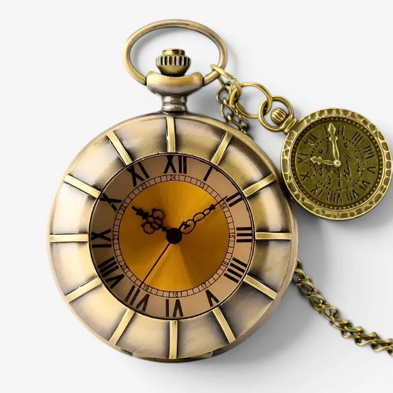 Old bronze pocket watch with an antique brass case golden face roman numerals and attached chain displayed