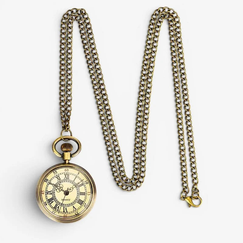 Antique brass-finished open face pocket watch with a cream-colored face roman numerals and matching chain quartz movement