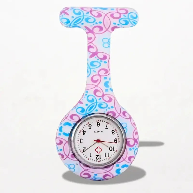 Original nurse watch featuring a pink and blue floral pattern with a round face silver bezel and red hands