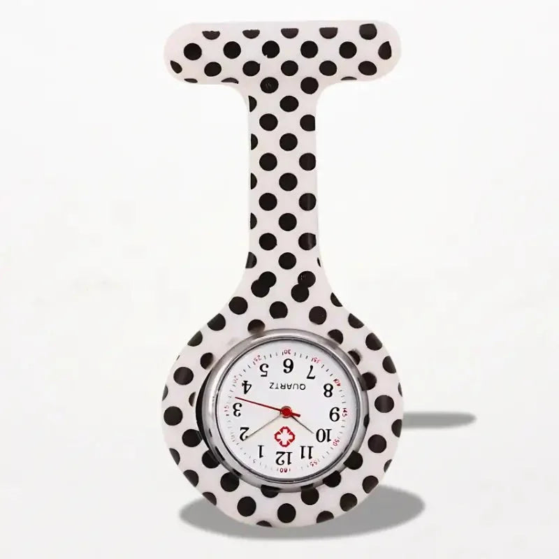 Original nurse watch with white and black polka-dotted face silver bezel red hands and medical cross emblem