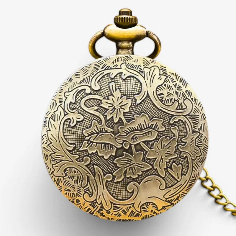 Antique brass owl pocket watch with intricate floral engravings and matching chain for vintage style timekeeping