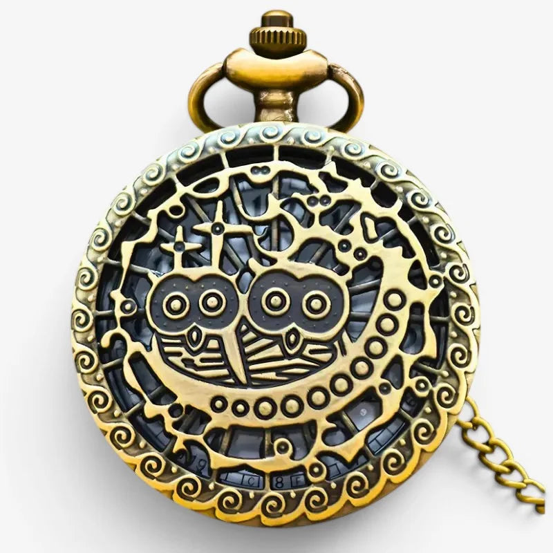 Antique brass owl pocket watch with intricate filigree detailing and matching chain for vintage style use