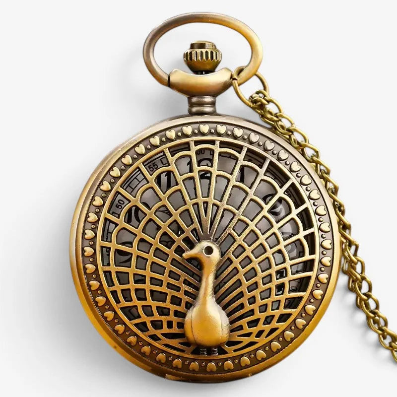 Antique brass peacock pocket watch with intricate feather design heart-patterned border and delicate wearing chain