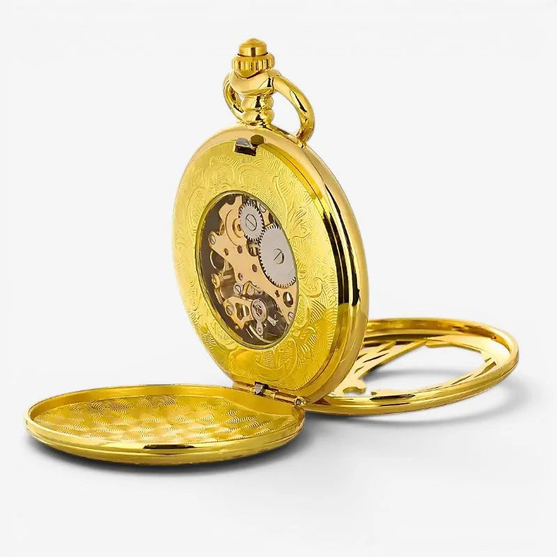 Golden phoenix pocket watch with intricate engraved patterns and visible mechanical movement inside