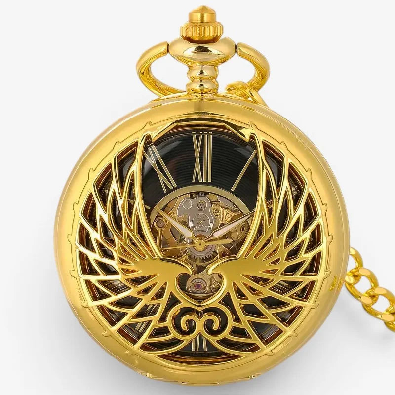 Golden phoenix pocket watch with intricate winged design, black face, roman numerals, and visible mechanical gears