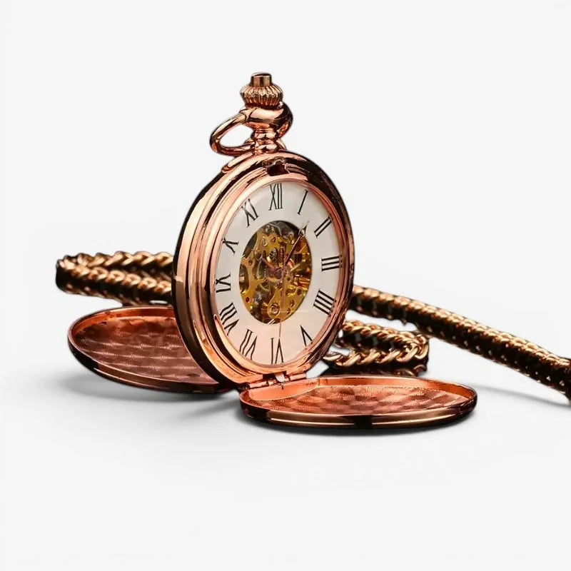 Pink mechanical pocket watch in rose gold with roman numerals, visible gears, and a textured chain