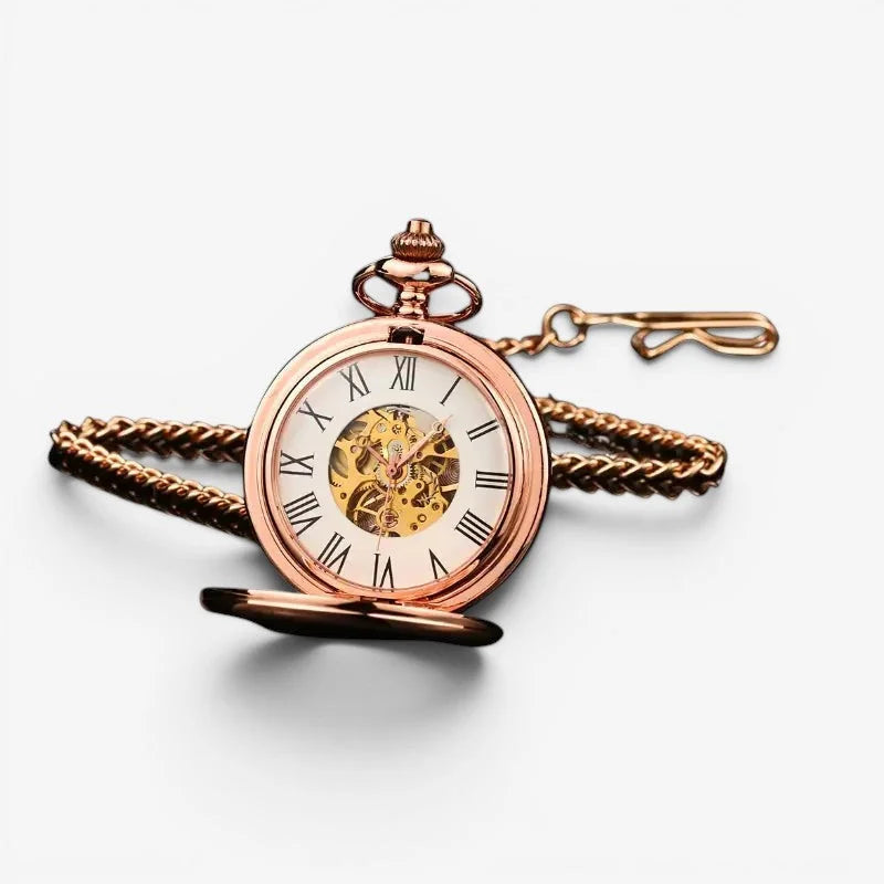 Pink mechanical pocket watch in rose gold with skeletonized face roman numerals and braided chain attached
