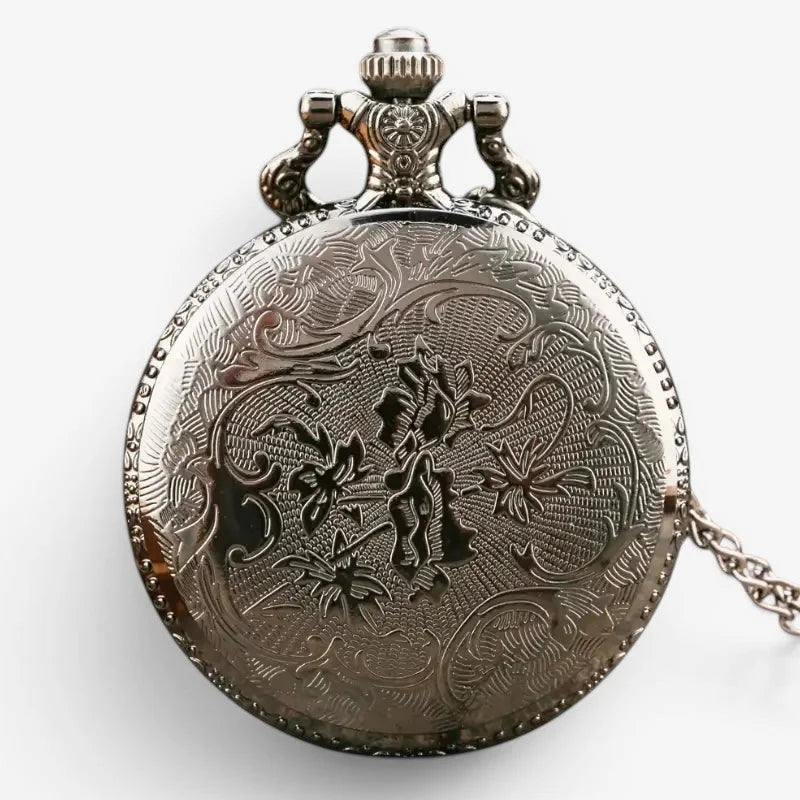 Antique silver-toned pocket watch compass combo with intricate floral engraving decorative crown and attached chain