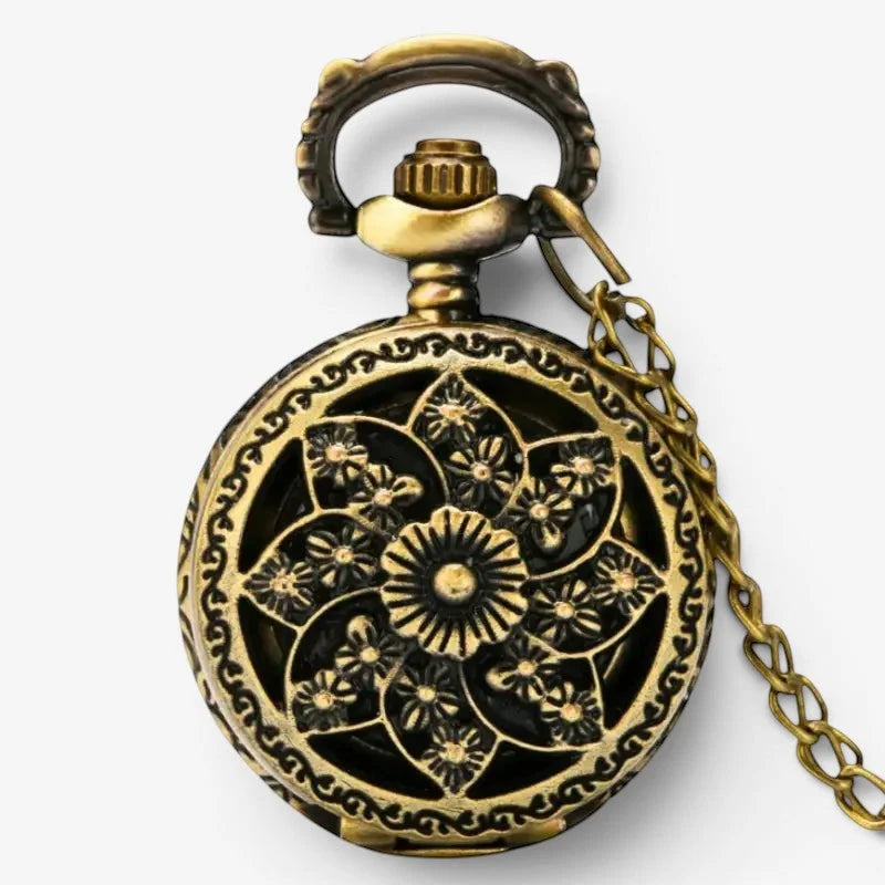 Antique brass pocket watch fob pendant with intricate floral filigree design and matching chain