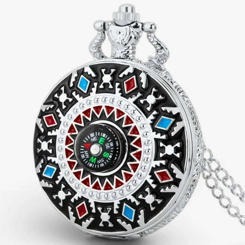 Silver-toned pocket watch with black red and blue geometric enamel design featuring an integrated compass face