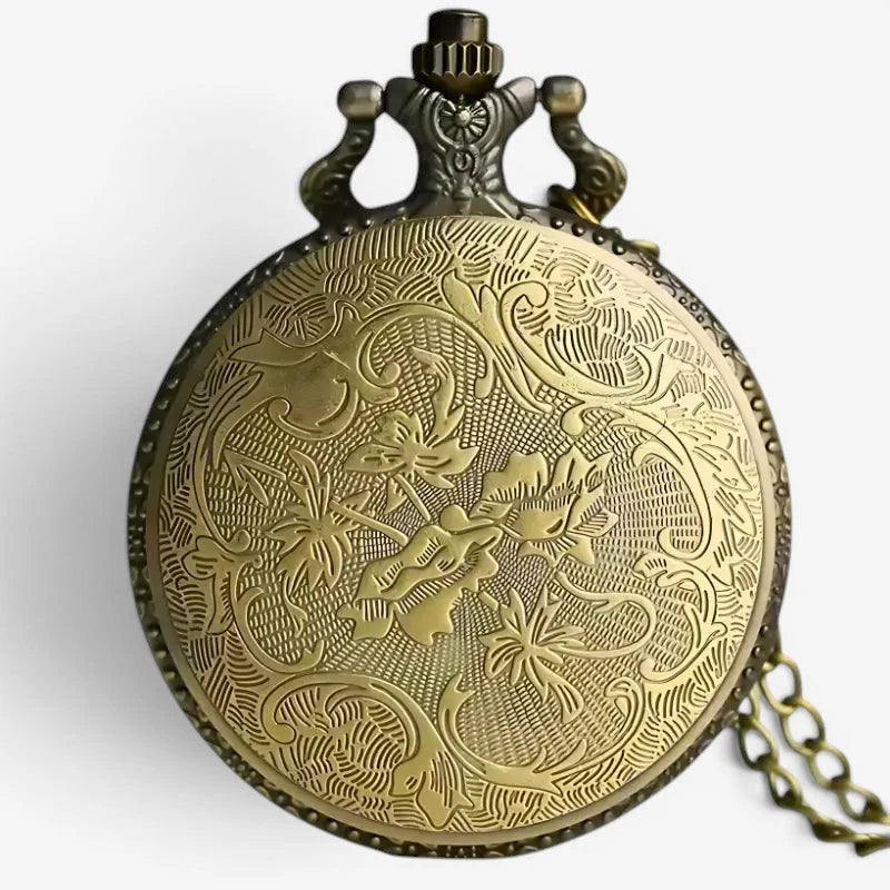 Antique brass poker pocket watch with intricate floral engravings and decorative crown-shaped clasp