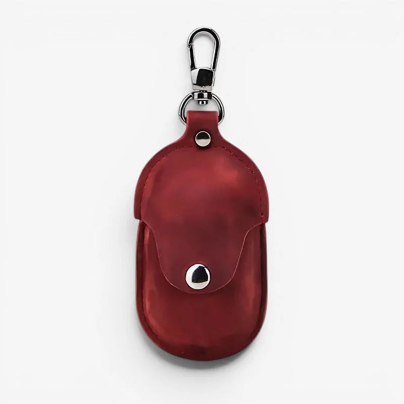 Red leather protective pocket watch case with silver-toned metal clasp and snap button closure