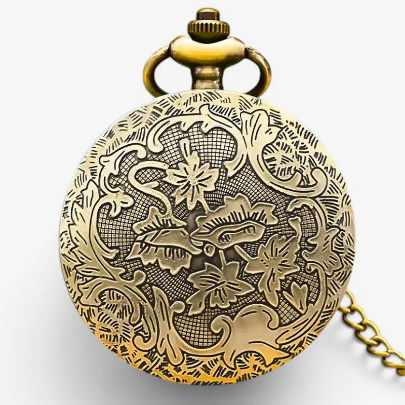 Antique brass quartz flower pocket watch with intricate floral and vine engraving and decorative crown on face