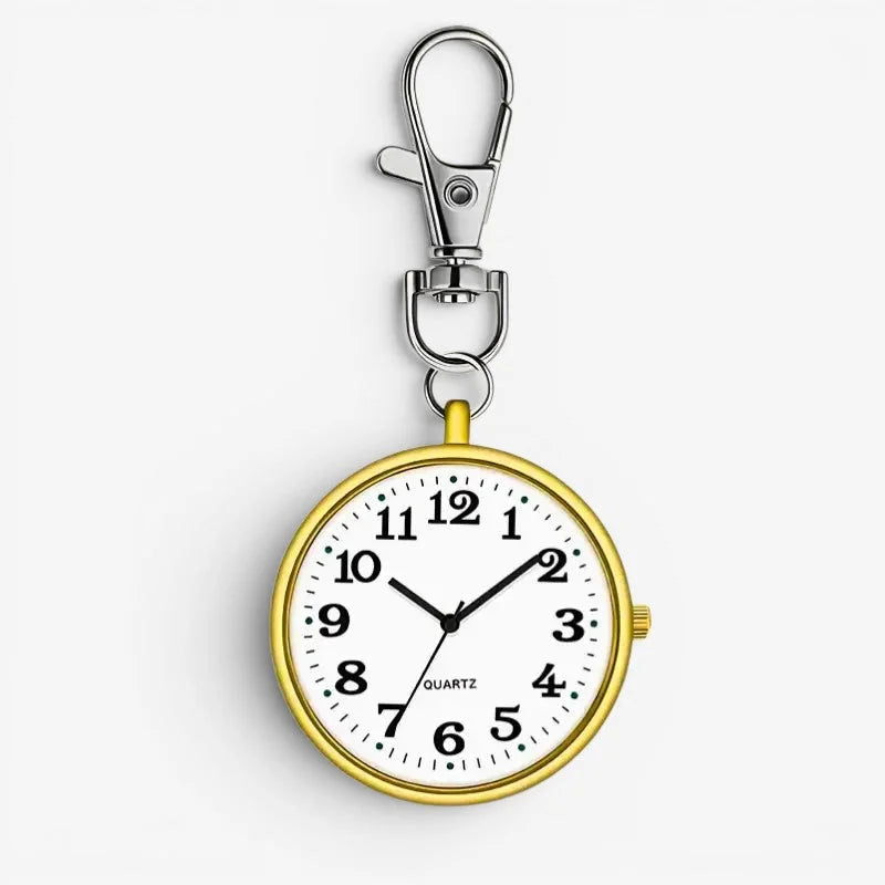 Gold-toned quartz nurse watch with white face black numerals and hands and silver clasp for keychain attachment