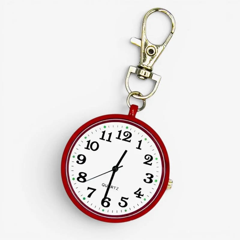 Red circular quartz nurse watch keychain with white face black numerals green dot markers and black hands