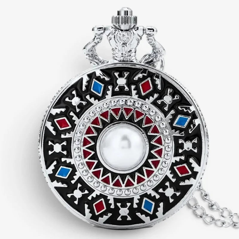 Silver quartz pocket watch necklace with intricate black red and blue enamel geometric designs and a central pearl dial