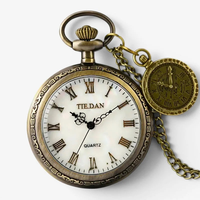 Antique brass-finished quartz pocket watch with white dial roman numerals and attached chain for classic timekeeping