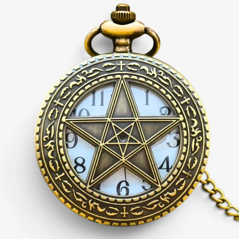 Antique brass quartz star pocket watch with a pentagram design on the face and ornate engraved border