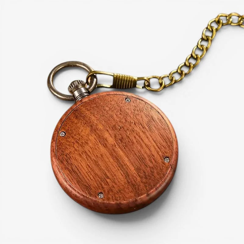 A round quartz wood pocket watch with richly grained reddish-brown wood and a brass chain and clasp