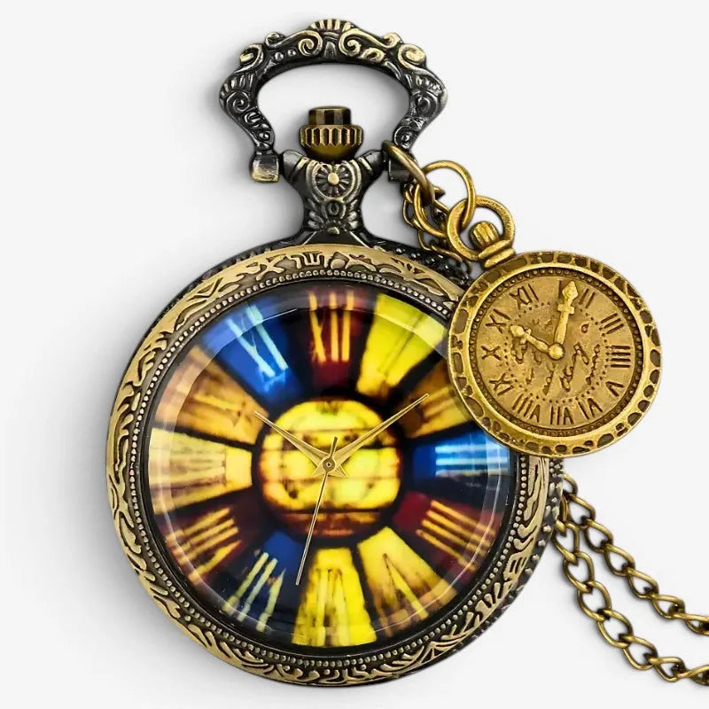 Antique-style brass rainbow pocket watch with ornate detailing and stained-glass-inspired yellow blue and red face