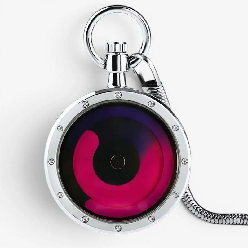 A sleek silver red futuristic pocket watch with a vibrant pink purple gradient dial and gemstone polished metal frame