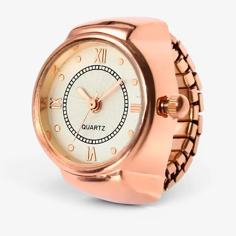 Rose gold quartz ring watch with round face, roman numerals, textured bezel, and adjustable metal band