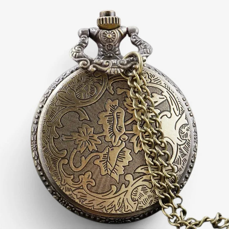 Antique-style brass ryuk death note pocket watch with intricate floral engravings and ornate clasp
