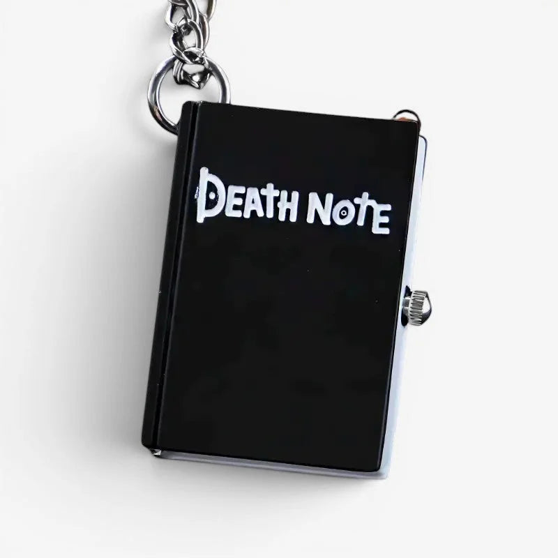 Black death note pocket watch keychain with silver chain and small metallic dial on the side by ryuk