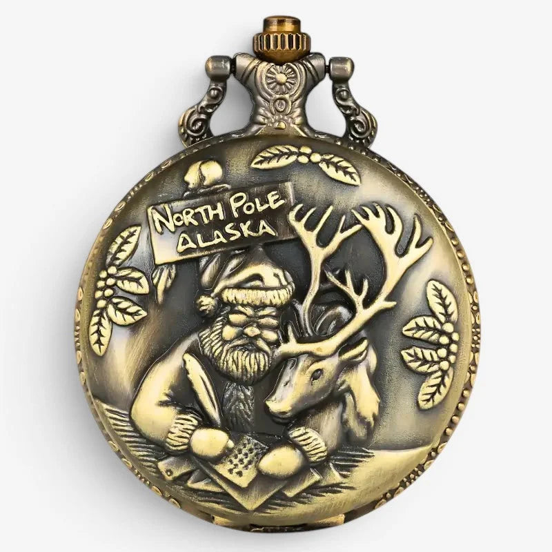 Antique brass-colored santa claus pocket watch with detailed relief of santa and reindeer and north pole alaska inscription