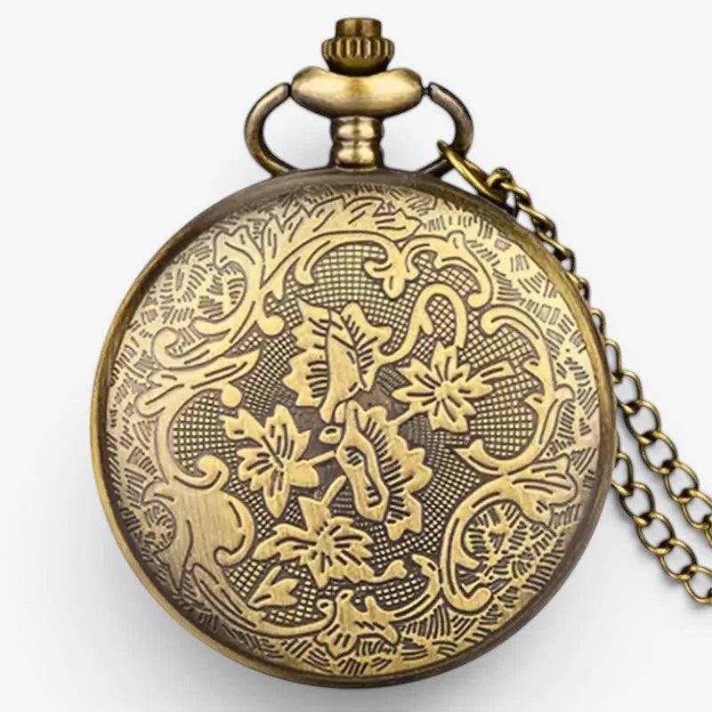 Antique brass scorpion pocket watch with intricate floral and vine engraving on circular face and matching chain