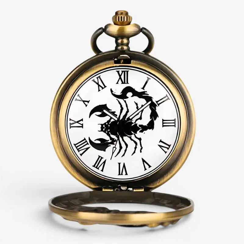 Antique brass scorpion pocket watch with white face and black roman numerals featuring a prominent scorpion design