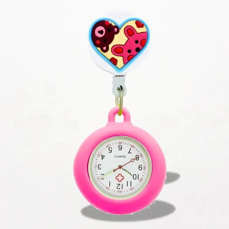 Silicone nurse watch with a pink silicone frame white face black numerals heart clip with cartoon bears on yellow background