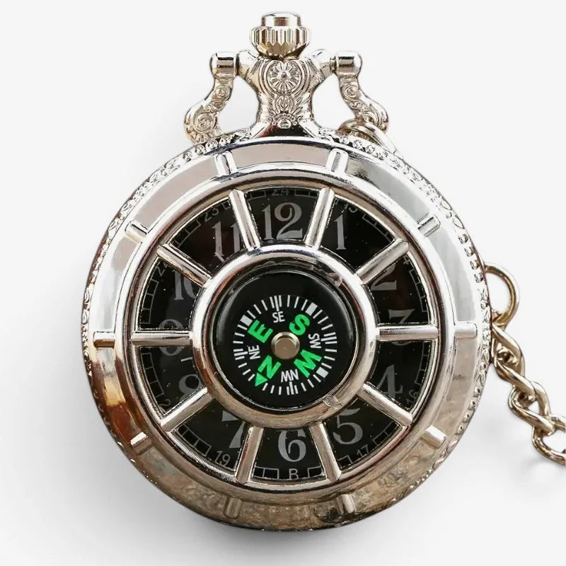 Silver compass pocket watch with a silver tone ornate case and a compass face featuring roman numeral hour markers