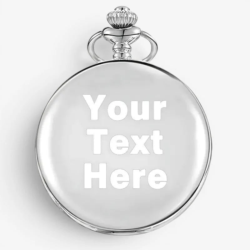 Silver engraved pocket watch with a polished silver-toned round case and ornate crown on top