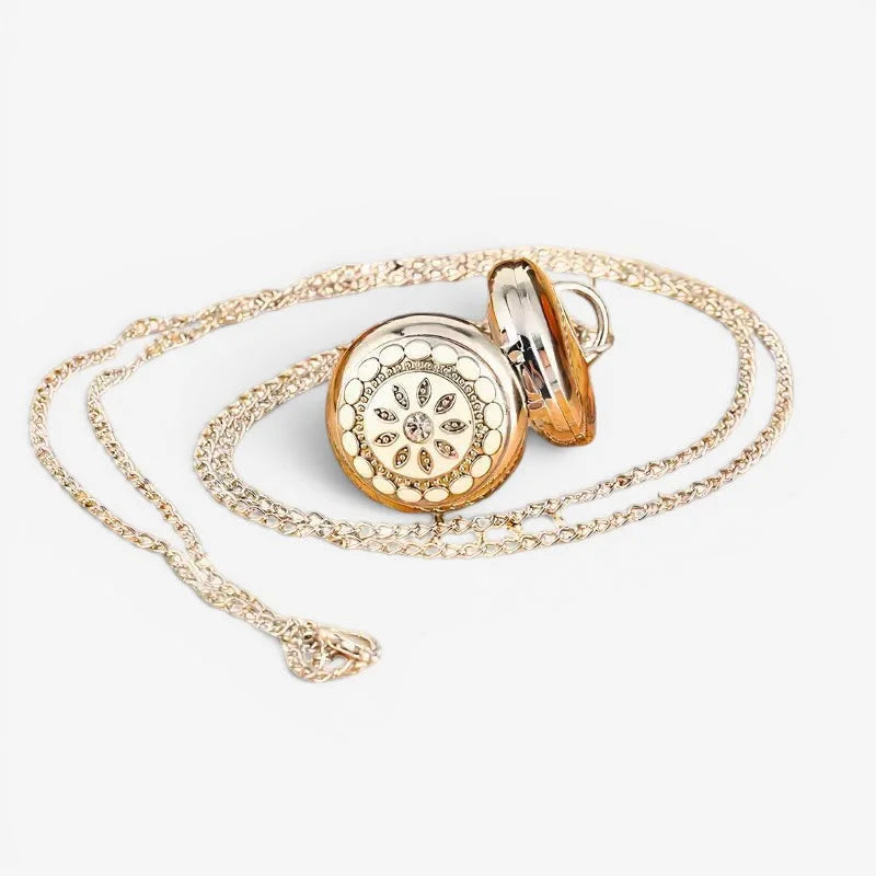 Silver flower pendant watch with gold-toned pocket watch, white enamel face, embedded crystals, and ornate chain