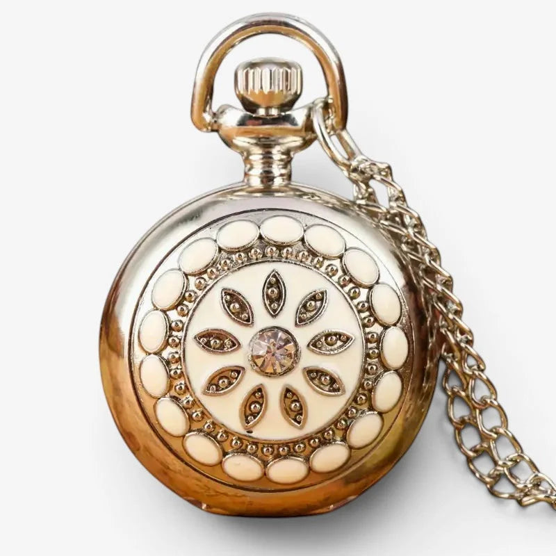 Silver flower pendant watch with gold-toned case ornate cream floral design central crystal and intricate metal detailing