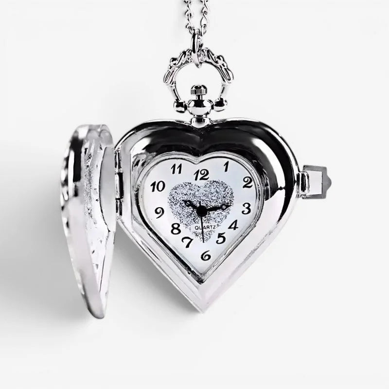 Silver heart pocket watch with quartz movement ornate chain and glittery center on the face