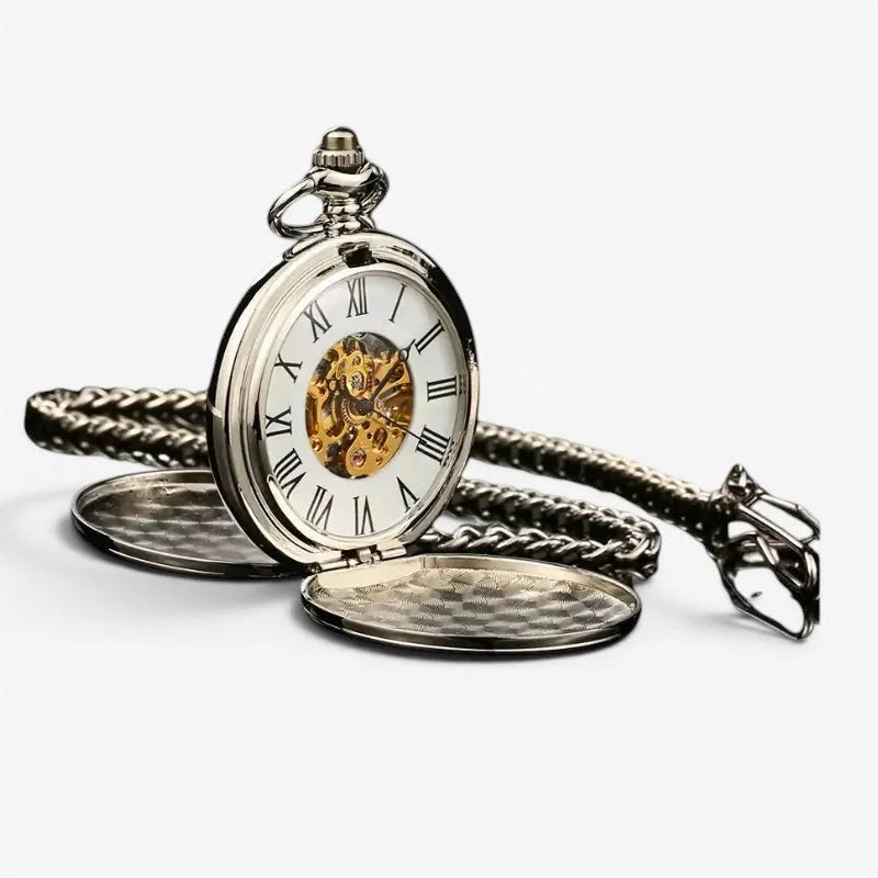 Silver mechanical pocket watch with visible golden movement white face roman numerals and braided silver chain